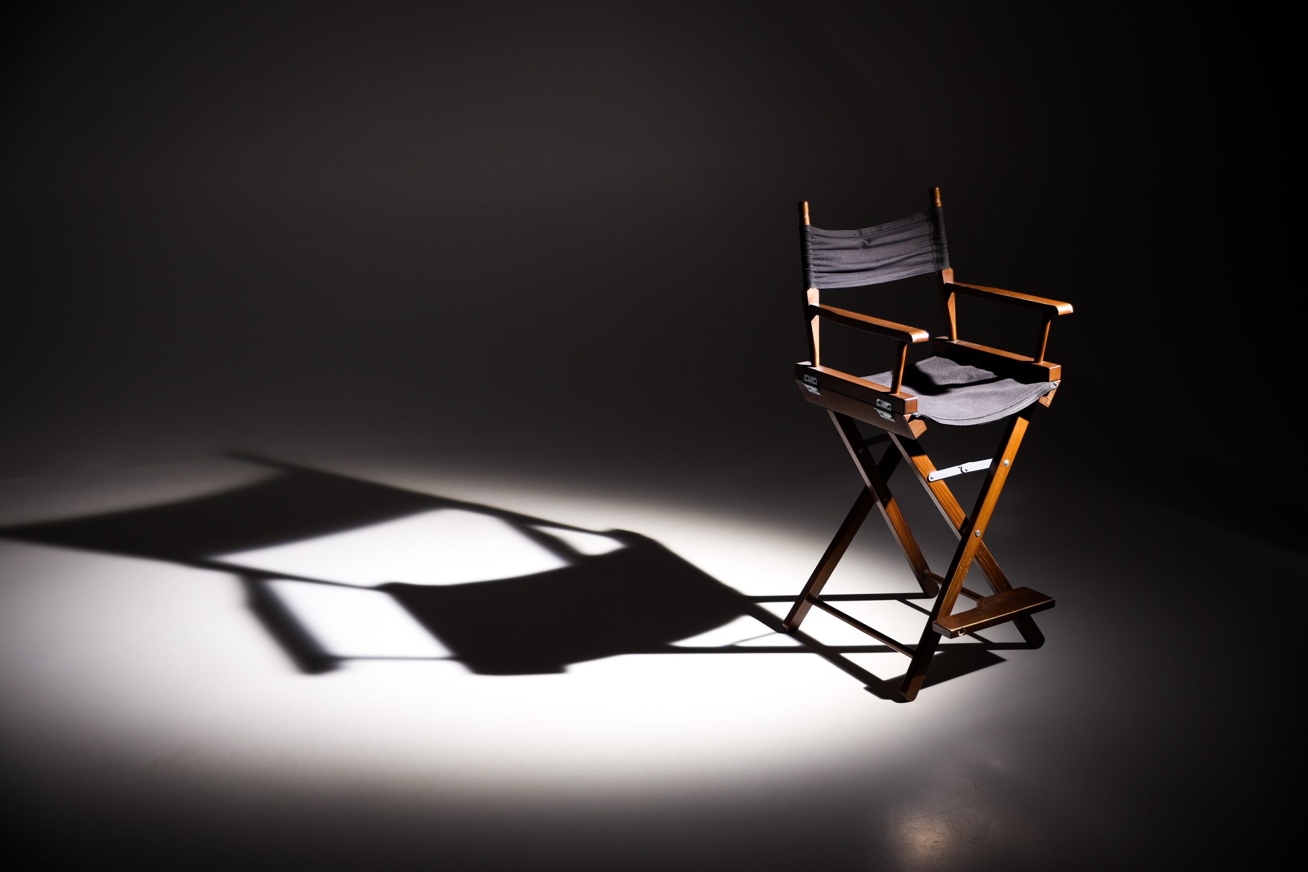 Directors,Chair,Stands,In,The,Beam,Of,Light.,Space,For Directors,Chair,Stands,In,The,Beam,Of,Light.,Space,For